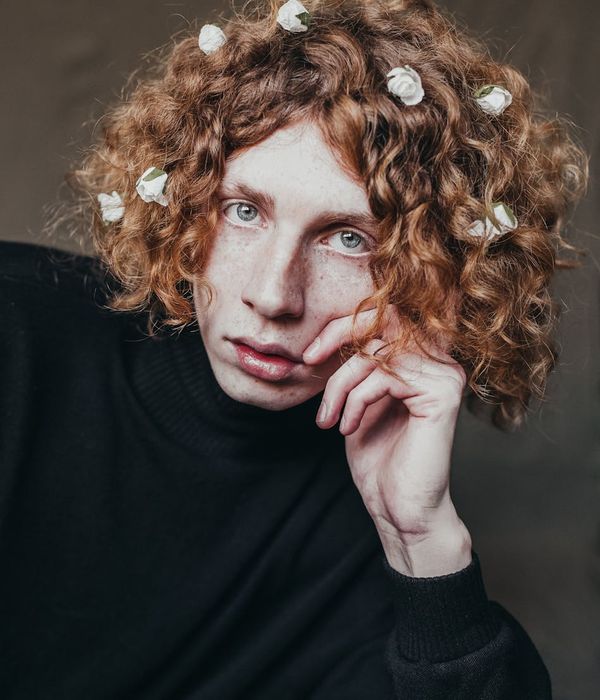 Young woman looking into the distance with a serene and clear expression